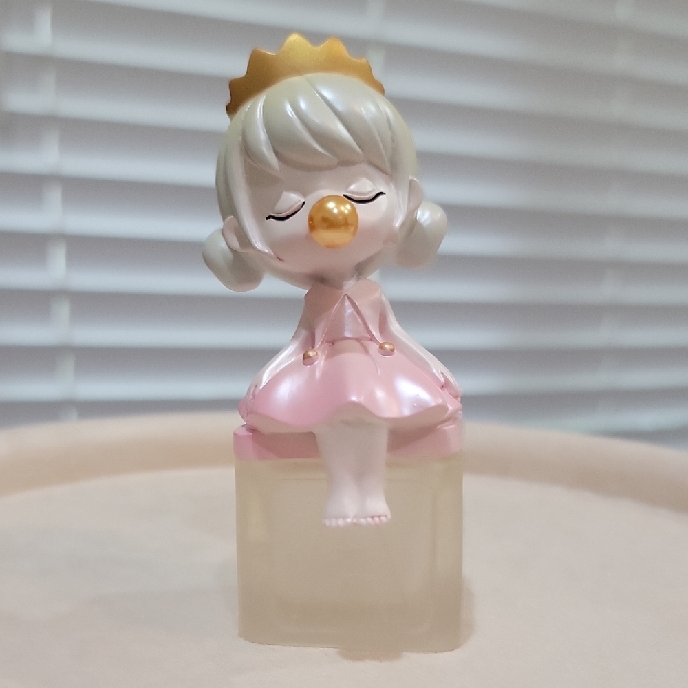 Pink and Gold Figurine with Crown